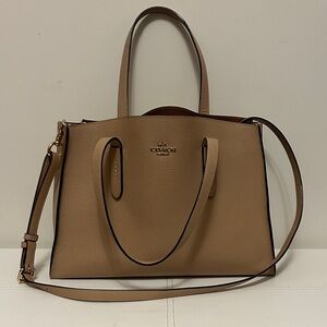 19. Coach Beige Leather  charlie carry all bag L 9 inches W 12 inches